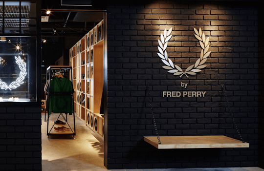 The Fred Perry Laurel Wreath Store in Singapore, designed by Studio Königshausen, pays homage to music and youth culture through its unique design. 